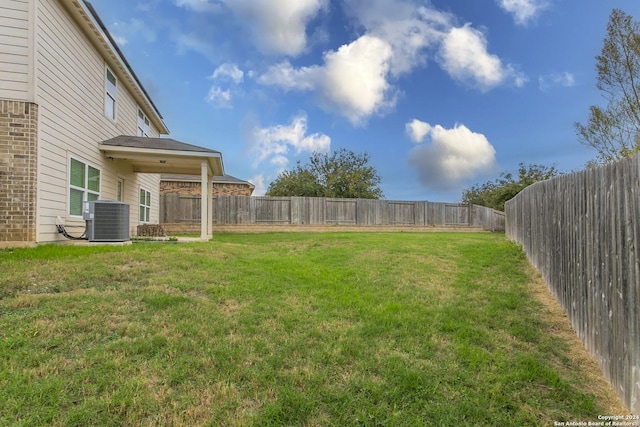 view of yard featuring central AC