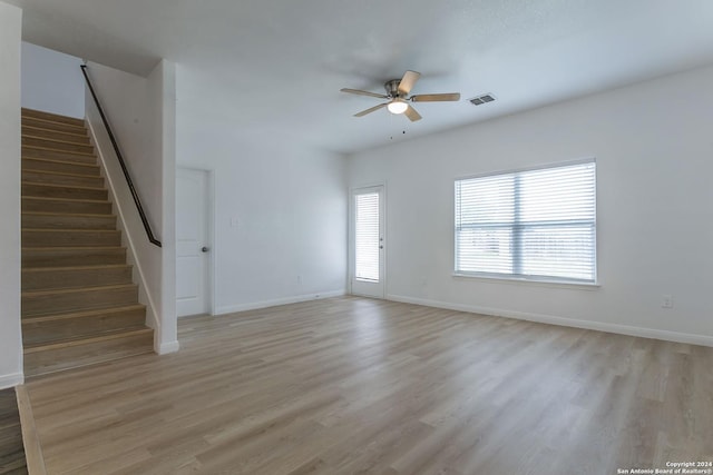 unfurnished living room with ceiling fan and light hardwood / wood-style floors