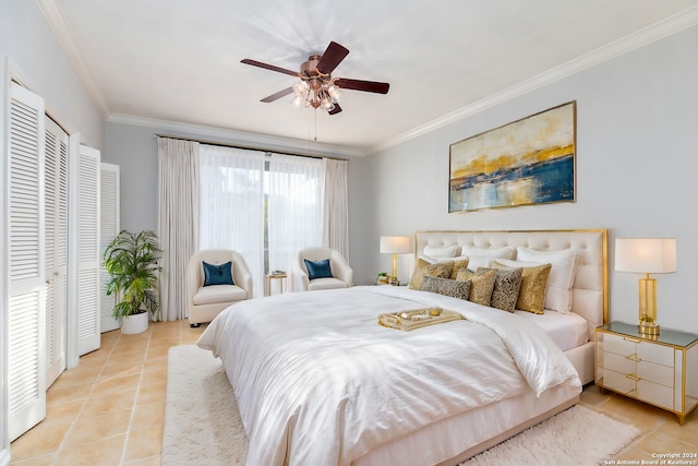 tiled bedroom with ceiling fan and ornamental molding