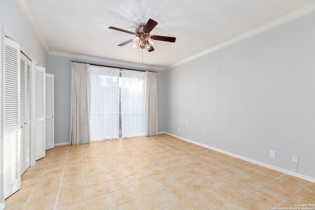 unfurnished bedroom with ceiling fan, light tile patterned floors, and crown molding