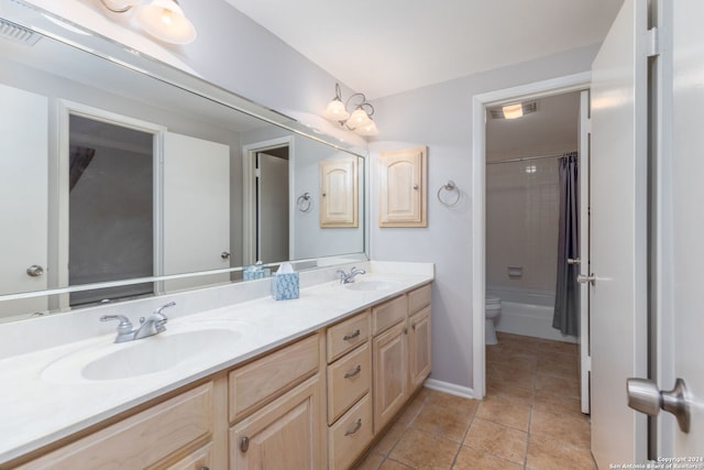 full bathroom with tile patterned floors, vanity, shower / bath combination with curtain, and toilet