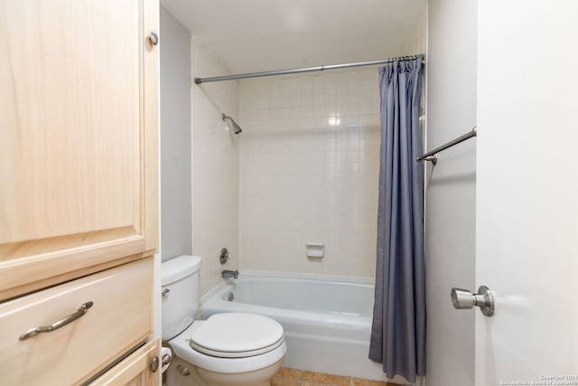 bathroom featuring tile patterned flooring, shower / bathtub combination with curtain, and toilet