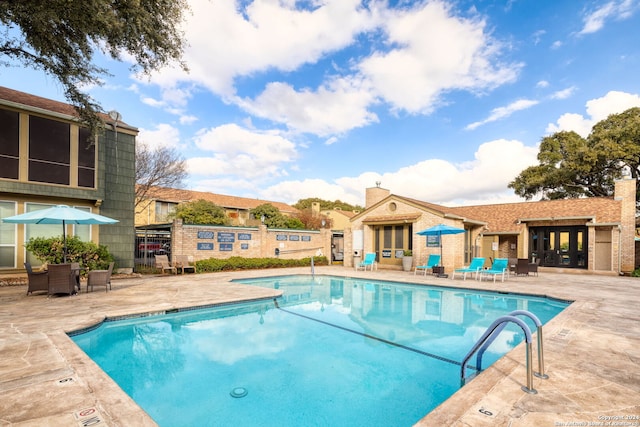 view of swimming pool featuring a patio