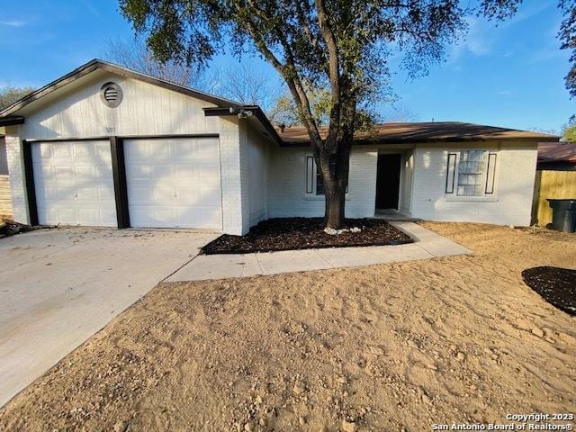 single story home featuring a garage