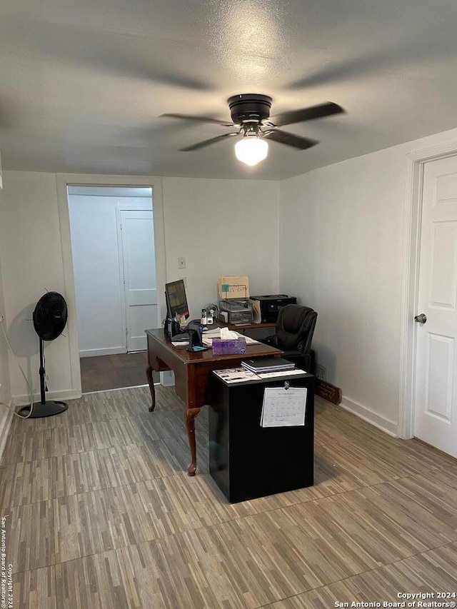 office space featuring hardwood / wood-style floors and ceiling fan