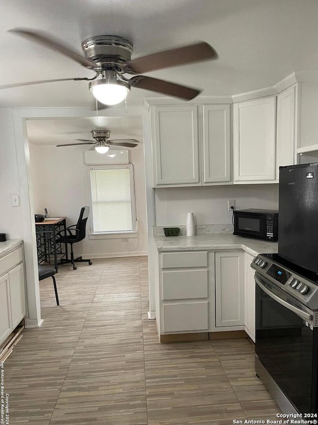 kitchen featuring white cabinets and stainless steel range with electric cooktop