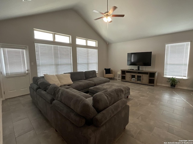 living room featuring high vaulted ceiling and ceiling fan