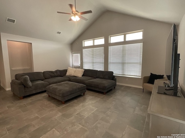 living room with ceiling fan and high vaulted ceiling