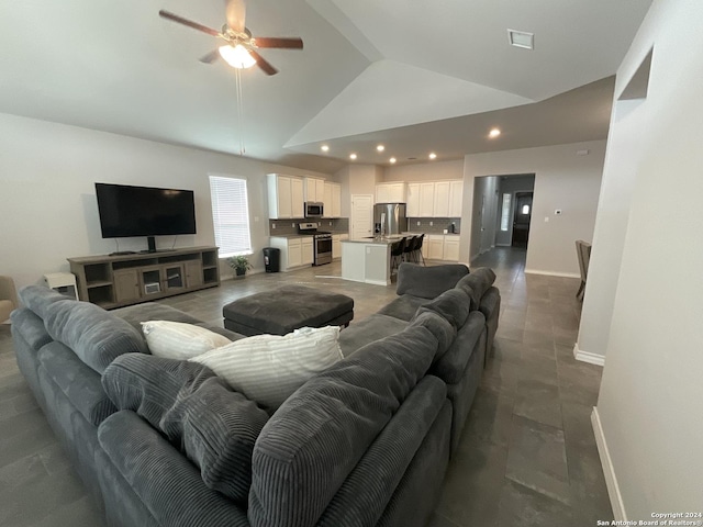 living room with ceiling fan and high vaulted ceiling