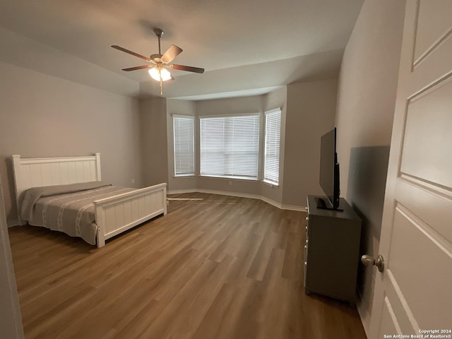 unfurnished bedroom featuring ceiling fan and wood-type flooring