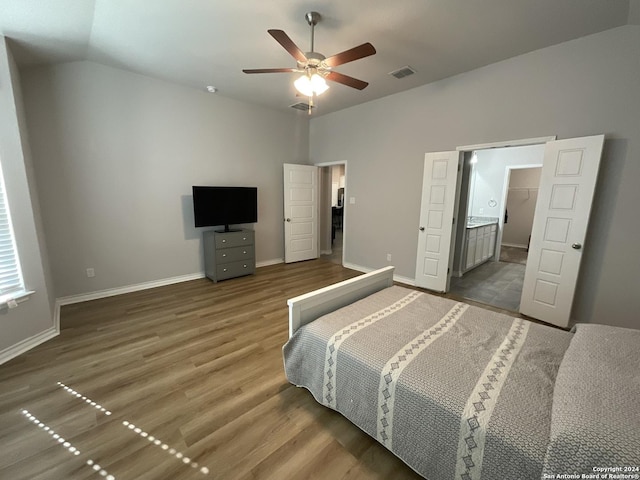 bedroom with dark hardwood / wood-style floors, ceiling fan, and lofted ceiling