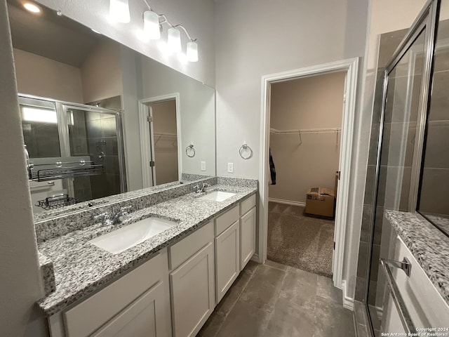 bathroom with vanity and an enclosed shower