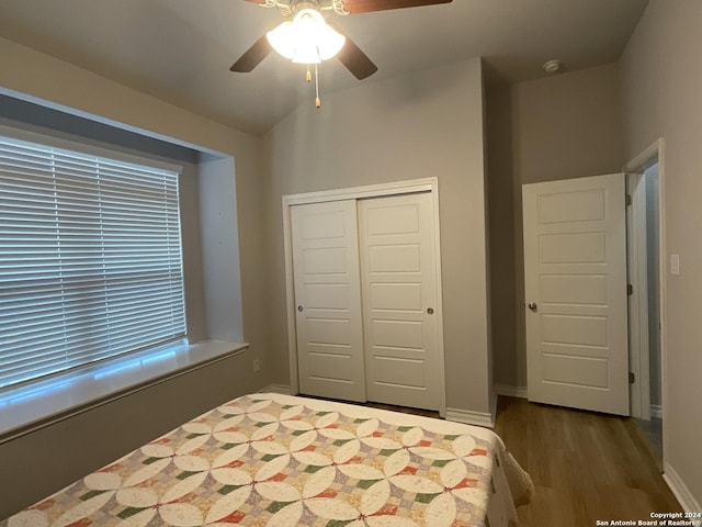 unfurnished bedroom featuring wood-type flooring, a closet, and ceiling fan