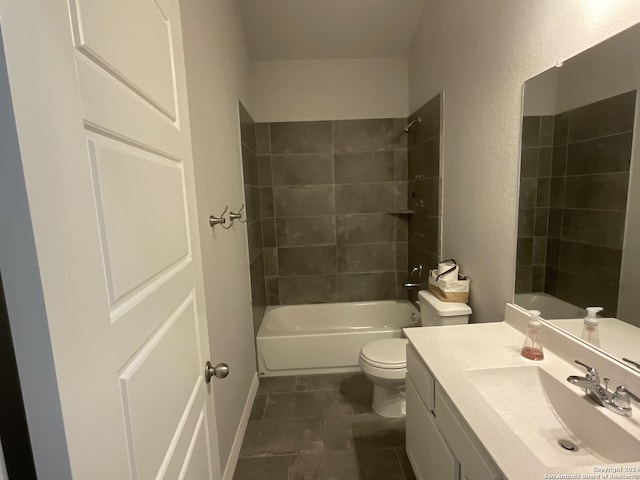 full bathroom with tile patterned flooring, tiled shower / bath combo, toilet, and vanity