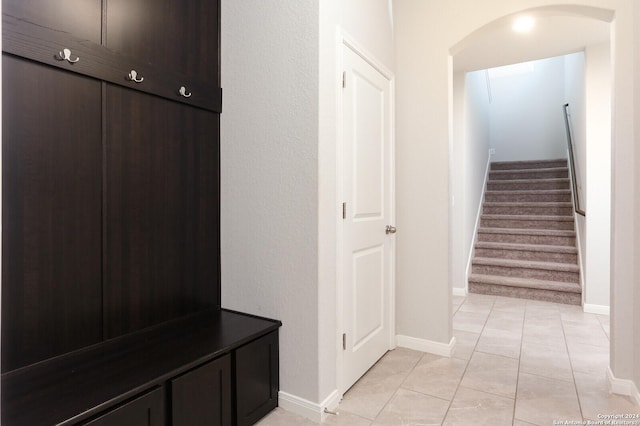 mudroom with light tile patterned floors