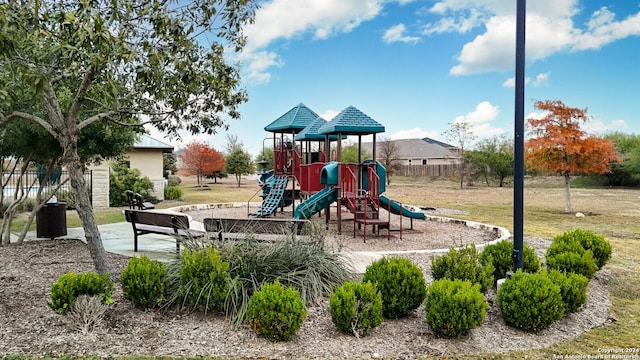 view of playground featuring a lawn