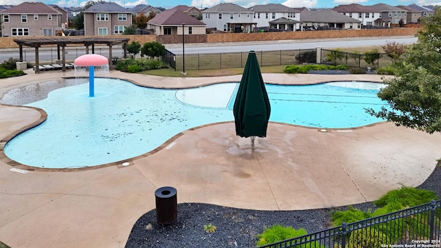 view of swimming pool featuring a patio area and a pergola