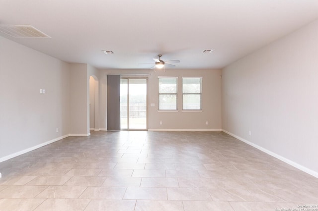 unfurnished room featuring ceiling fan and light tile patterned floors