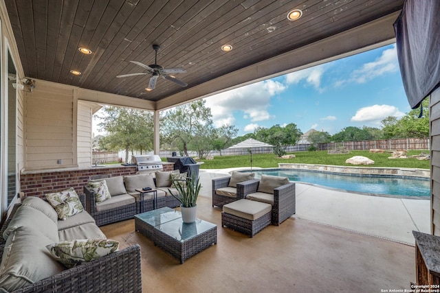 view of patio featuring a fenced in pool, grilling area, ceiling fan, and an outdoor hangout area