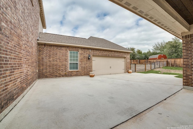 view of side of home featuring a patio area