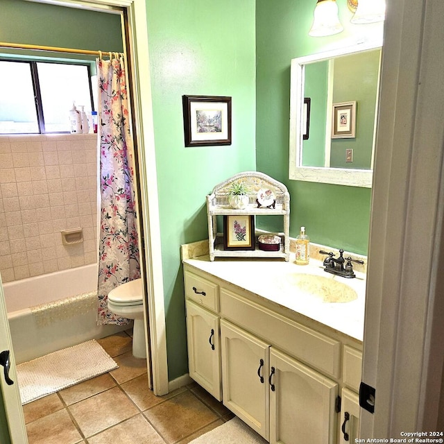 full bathroom with tile patterned floors, vanity, shower / tub combo, and toilet