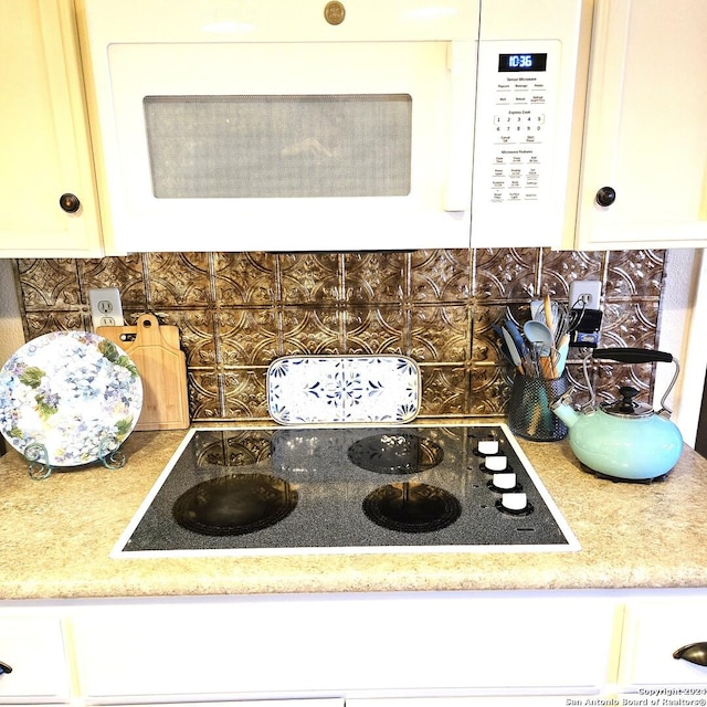 kitchen featuring decorative backsplash and electric cooktop