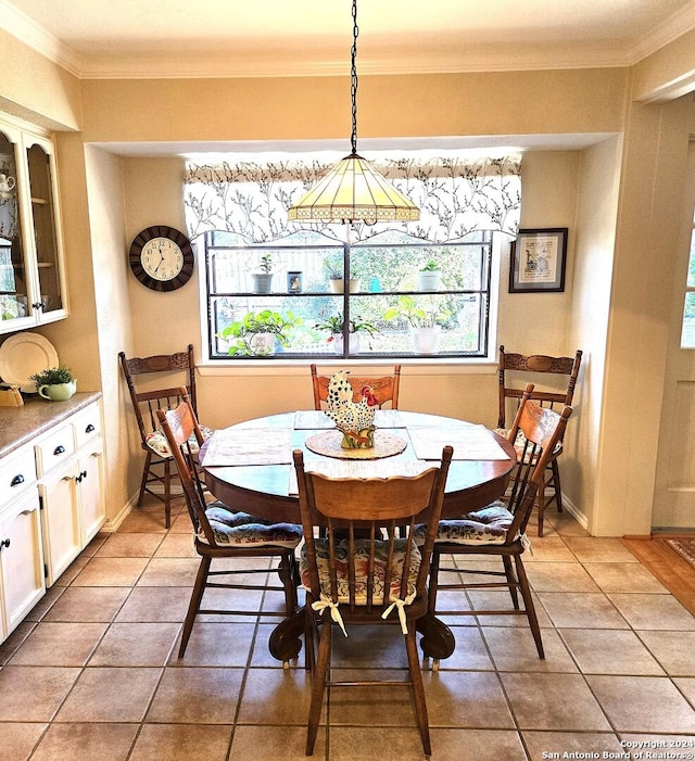 tiled dining space with ornamental molding