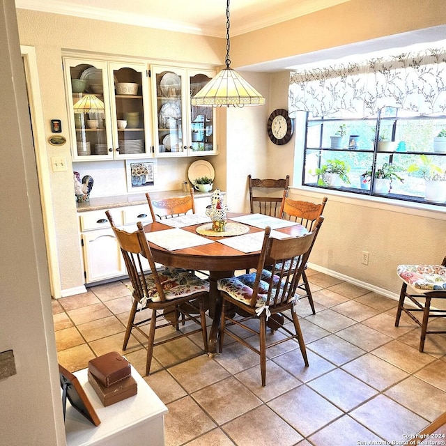 tiled dining area with ornamental molding