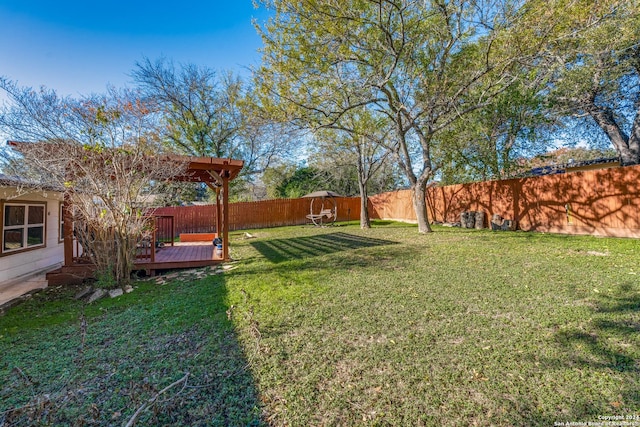 view of yard with a wooden deck