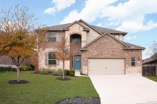 view of front of home featuring a front yard and a garage