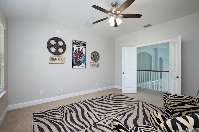 carpeted bedroom featuring ceiling fan and lofted ceiling