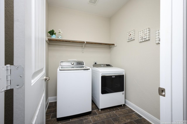 laundry area with washing machine and clothes dryer