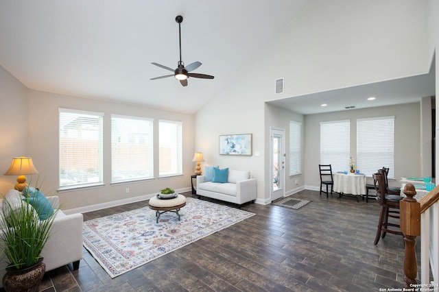 living room with ceiling fan, dark hardwood / wood-style flooring, and high vaulted ceiling