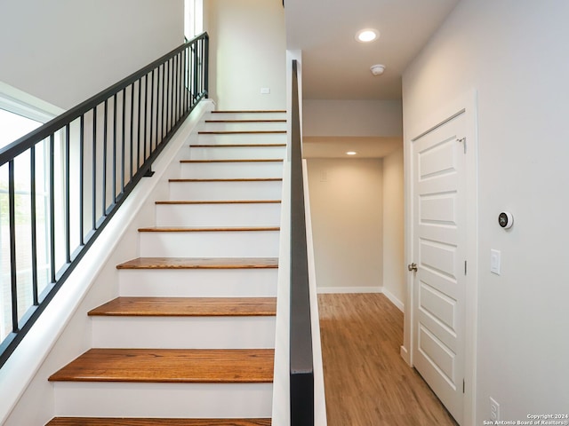 staircase featuring hardwood / wood-style floors