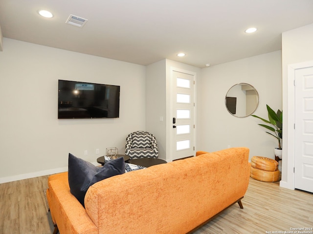 living room with light hardwood / wood-style flooring