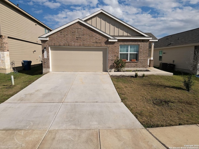 craftsman-style home with a garage and a front lawn