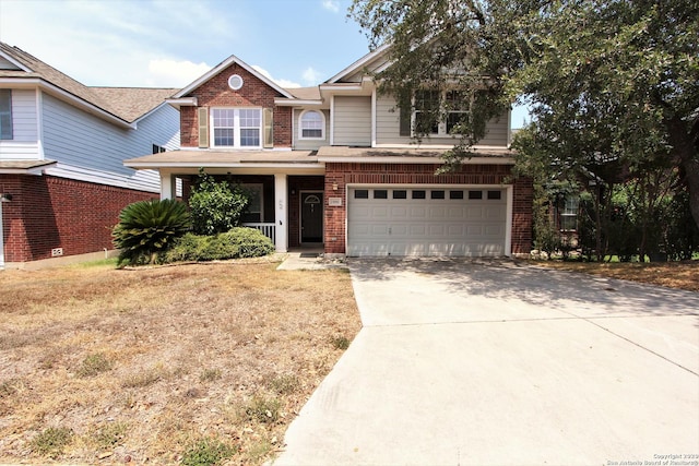 view of front of property with a porch and a garage