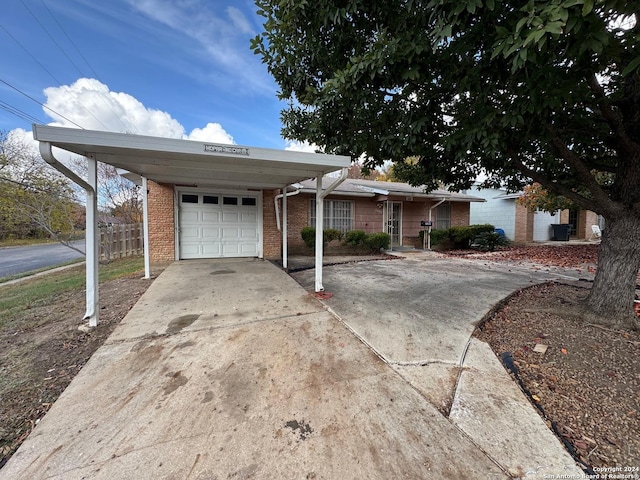 ranch-style home featuring a carport and a garage