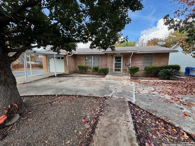 single story home with a garage