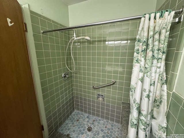 bathroom with a shower with shower curtain