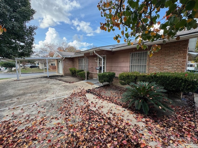 ranch-style house with a carport