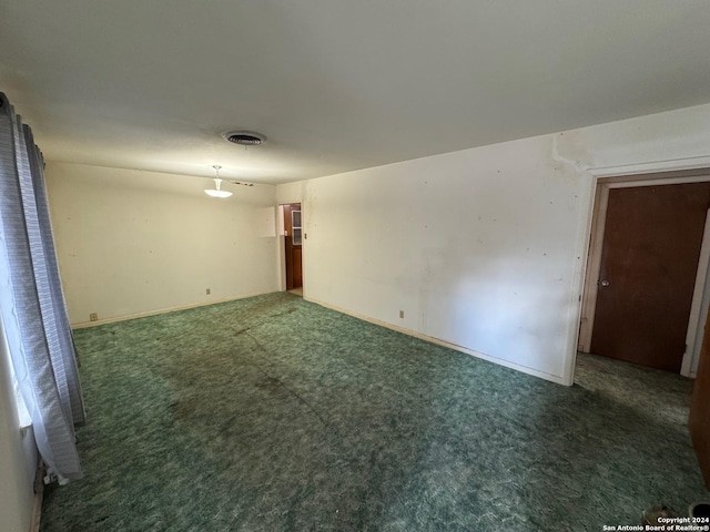 unfurnished bedroom featuring dark colored carpet