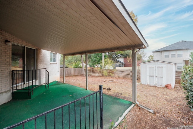 view of patio with a shed