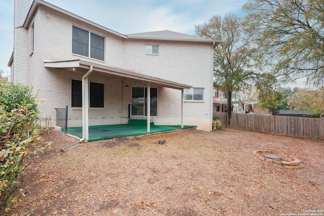 back of property featuring a patio