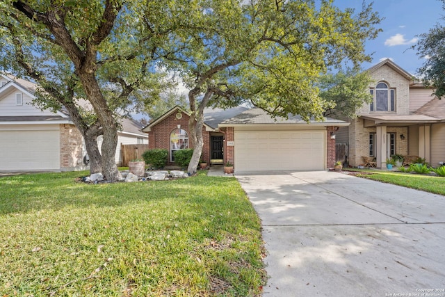 view of front of house featuring a garage and a front yard