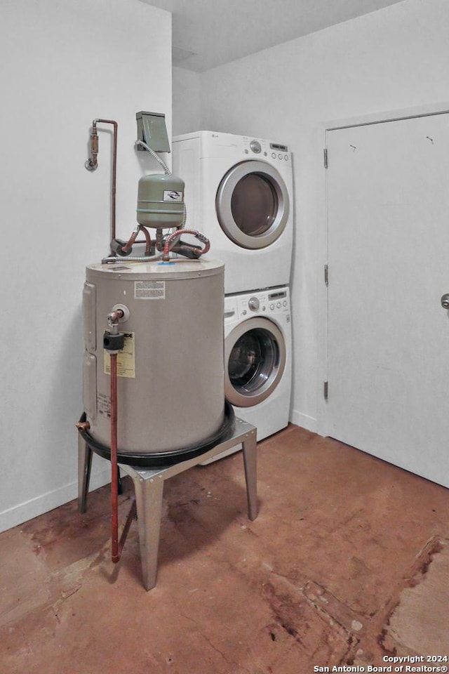 laundry room with electric water heater and stacked washer and clothes dryer