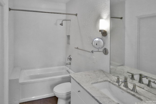 full bathroom featuring bathtub / shower combination, vanity, and toilet