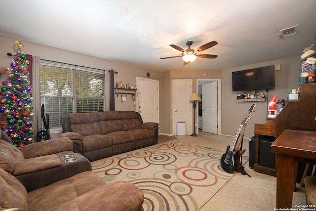 living room with light colored carpet and ceiling fan