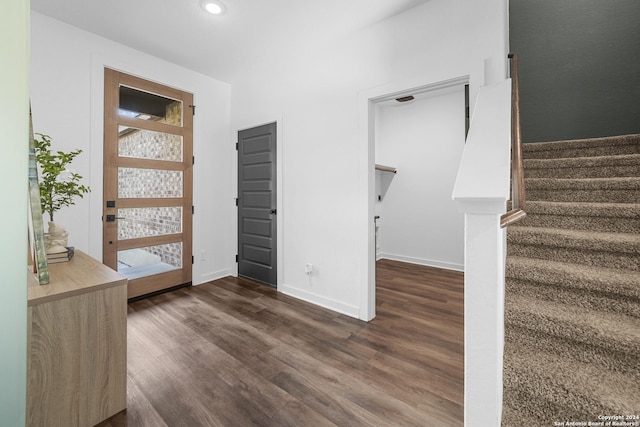 entryway with dark hardwood / wood-style floors