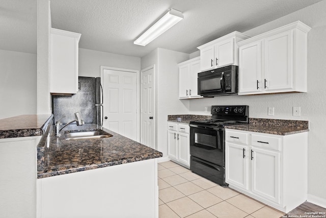 kitchen featuring kitchen peninsula, sink, white cabinetry, and black appliances